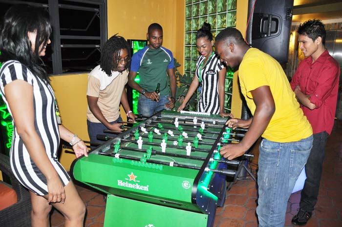 Adesina Flatts (right) plays in a keenly contested Foosball Final, which he won against Stephen Henry at Altitude Bar and Lounge.