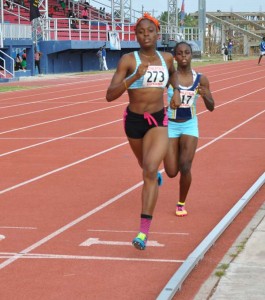 Andrea Foster leads Jevina Sampson after the first lap of the U-20 Girls 800m; Foster went on to win the race.