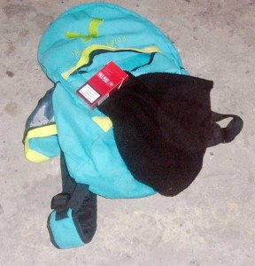 Items that the bandit left behind - a haversack, toque and a pack of cigarettes   