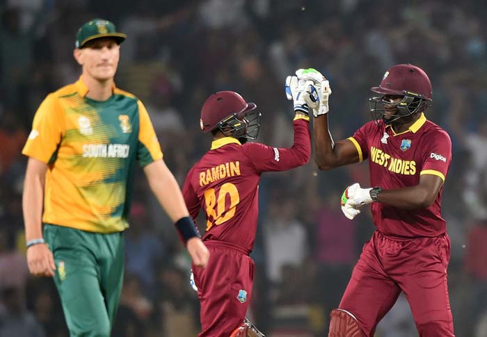 Carlos Brathwaite and Denesh Ramdin celebrate West Indies’ win, South Africa v West Indies, World T20 2016, Group 1, Nagpur, March 25, 2016 ©AFP