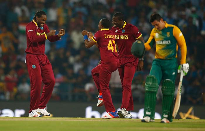 Chris Gayle and Dwayne Bravo celebrate the wicket of Quinton de Kock, South Africa v West Indies, World T20 2016, Group 1, Nagpur, March 25, 2016 ©IDI/Getty Images