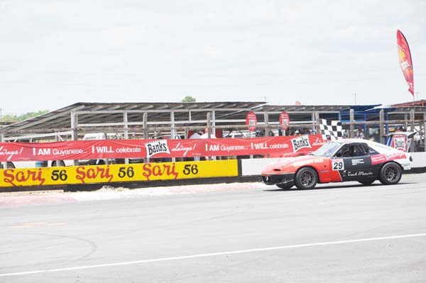  (Flashback)- Group 4 race Danny Persaud seen with the chequered flag following one of his victories.  