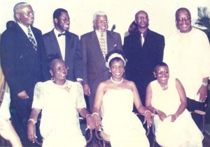 In the company of his cousins. Standing from left: Dr. Claude Denbow, Dr. Frank Denbow, Professor Charles Denbow, Retired Guyana Airways Captain, Rev. Louis Crawford, Retired Col. Fairbairn Liverpool. Seated from left: Mrs. Roderine Moses, Dr. Louise Liverpool-Grant and Dr. Sarah Crawford-Gordon.