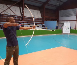 Director of Sport, Mr. Christopher Jones, taking the first shot to declare the Indoor Target Archery Competition open.