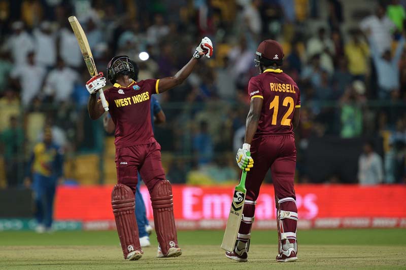 Andre Fletcher and Andre Russell celebrate West Indies’ win, Sri Lanka v West Indies, World T20 2016, Group 1, Bangalore, March 20, 2016 ©AFP