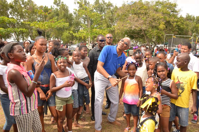 This group of little ones was more than happy to have the President assist them to fly their kite. 