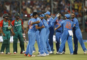 Indian players celebrate their win against Bangladesh in the ICC World Twenty20 2016 cricket match in Bangalore, India, Wednesday, March 23, 2016. (AP Photo/Aijaz Rahi)