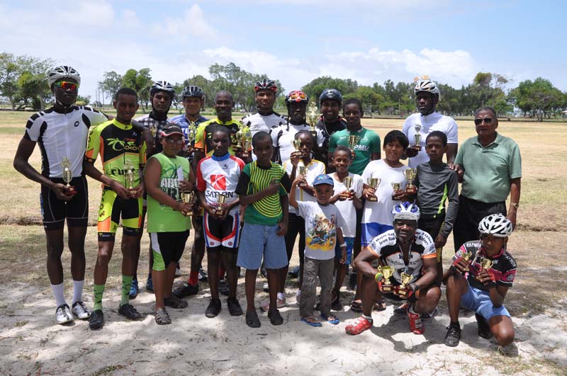 Individual category winners and other recipients of prizes pose with race organiser Hassan Mohamed (standing at right) following yesterday’s presentation.