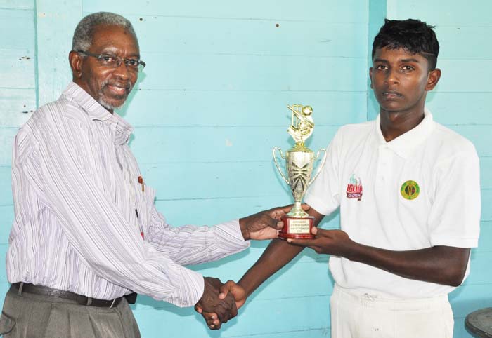  Sagar Hatheramani accepts his man-of-the-match prize from match referee Grantley Culbard.