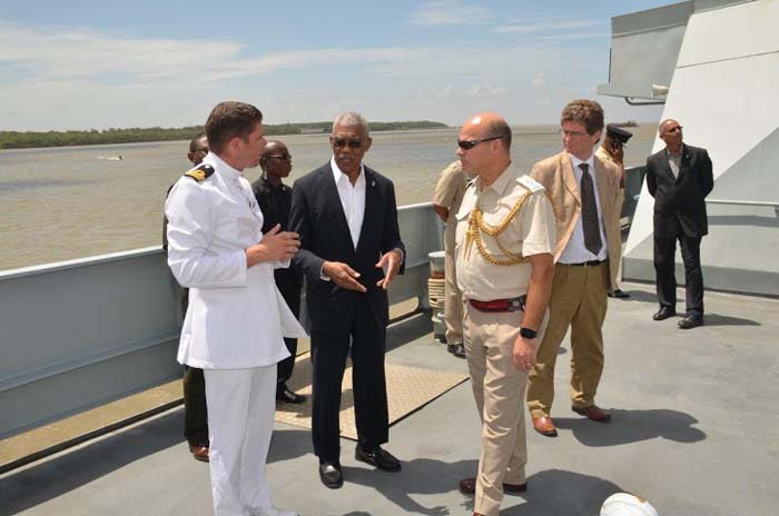 President David Granger in discussions with Commanding Officer, Lieutenant Commander Richard Hewitt and Lieutenant Colonel Patrick Brown as British High Commissioner to Guyana, Mr.  James Quinn looks on, aboard the HMS Mersey. (Photo courtesy Ministry of the Presidency)