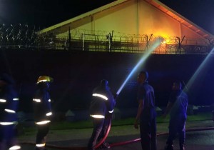 Fire fighters attempt to extinguish the prison blaze 