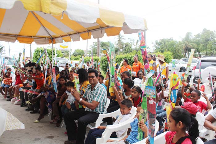 A section of the gathering yesterday: Sponsors, Lions Club representatives (front row), along with parents and some of the children from the area.