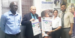 Public Health Minister Dr. George Norton along with Dr. Shailendra Sugrim (right), an Ophthalmologist at the GPHC with representatives from Ansa McAl
