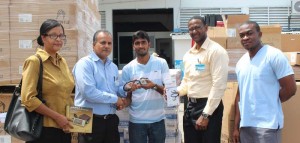  ‘Kent Vincent, CEO Food For The Poor, hands over medical items to doctors of the three hospitals.