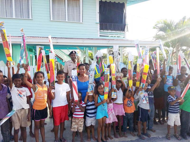 In photo ASP Fredericks with some of the happy children with their kites.