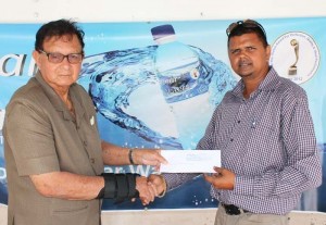 Marketing/Sales and Distribution Manager Narendra Lucknauth (right) hands over the cheque to Justice Cecil Kennard recently.