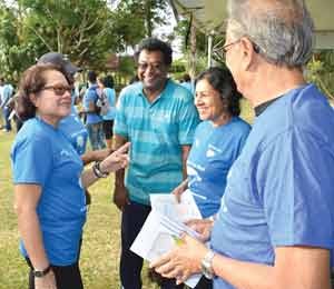 First Lady, Mrs. Sandra Granger (left) shares a warm exchange with Minister of Public Security, Mr. Khemraj Ramjattan (centre) and his wife,  Mrs. Sita Ramjattan and Minister of Education,  Dr. Rupert Roopnaraine (first right)   (Photo compliments of the Ministry of the Presidency)   