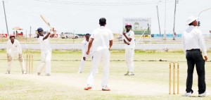 Akeem Hinds powers Gudakesh Motie for six during his 70 against GNIC at the GDF ground yesterday.