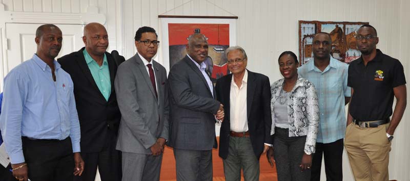 Minister of Education, Dr. Rupert Roopnaraine (fourth, right) shakes hands with CBC President, Glyne Clarke yesterday while Minister within the Ministry, which has responsibility for Sport, Dr. Nicolette Henry (third, right) share the moment with from left Permanent Secretary, Alfred King, GABF President, Nigel Hinds, Patrick Haynes, GABF VP, Kenrick Thomas and Director of Sport, Christopher Jones.