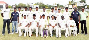 Champions Demerara successfully defend their U-17 title with a six-run win at Bourda yesterday. Second from right is Coach Gavin Nedd.