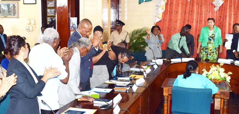 Deputy Mayor Sherod Duncan (hands clasped)