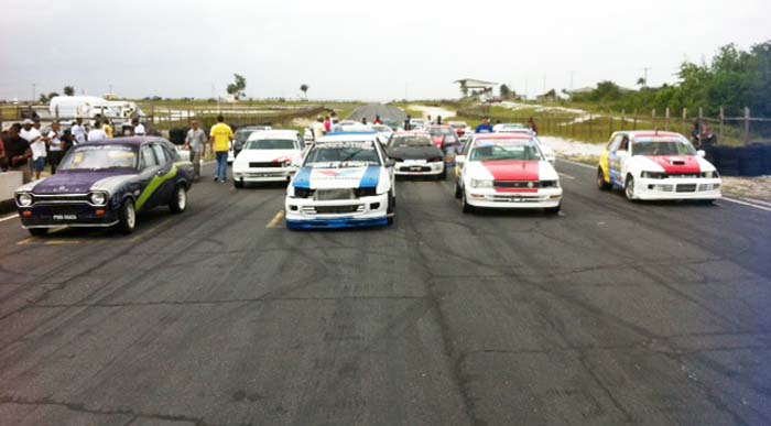 (Flashback) - Drivers lie up at the start line for the commencement of an Endurance race. 