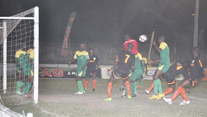 GDF’s goalkeeper is brought into action from a corner kick against Slingerz on Friday night at GFC ground.