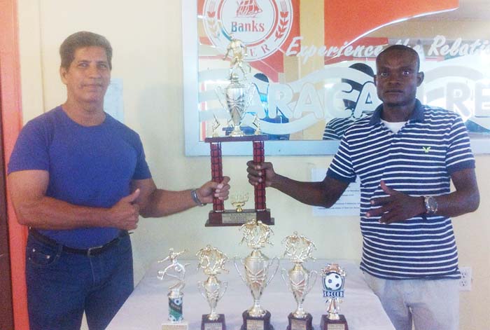 Aracari Resort General Manager, Dennis De Souza (left) and promoter Ceon Swan display the trophies on offer.