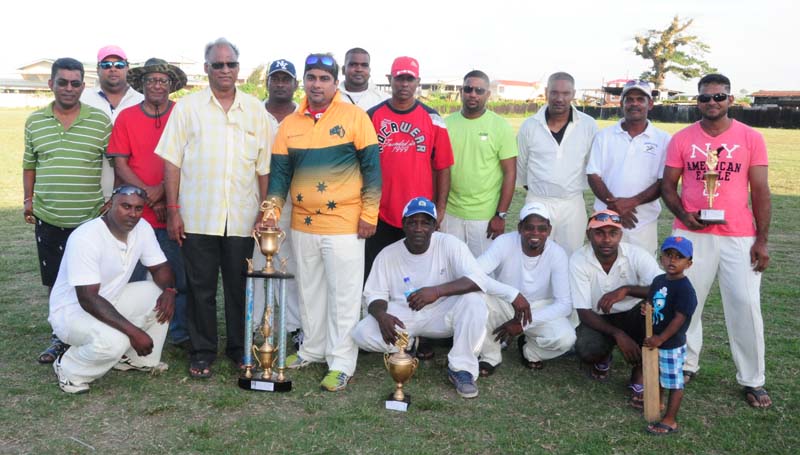 Members of the victorious Nandy Park team with their hardware. Former DOS Neil Kumar is standing fourth from left.