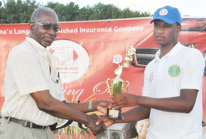 Ronaldo Mohamed accepts his man-of-the-match prize from referee Grantley Culbard