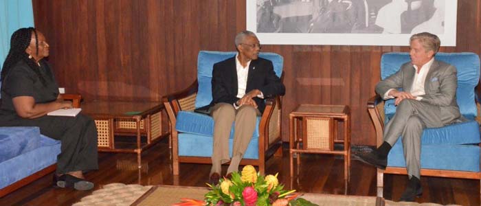  President David Granger converses with founder and Executive Chairman of Guyana Goldfields Incorporated, Patrick Sheridan along with the company’s Country Manager, Violet Smith.