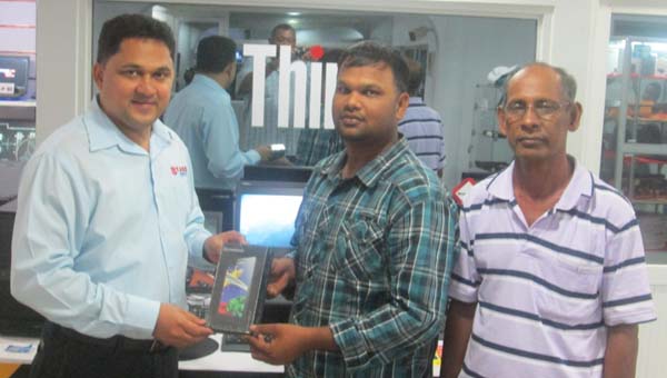 Mr. Majeed, General Manager of Starr Computer hands over the Notebook to Mark Papannah of the RHTYSC, MS.  