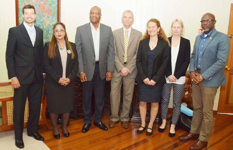 From left: Nikolaus Oudkerk, Project Management Office, Legal Advisor to the Ministry of the Presidency; Geeta Chandan-Edmond; Minister of State, Joseph Harmon; Tron Lovdal, Senior Adviser, Norwegian Agency for Development Cooperation, Department of Climate, Energy and Environment; Hege Ragnhildstveit, Senior Adviser, Government of Norway’s International Climate and Forest Initiative; Ane Marit Lid, Adviser, Norwegian Agency for Development Cooperation and Presidential Advisor on the Environment, Rear Admiral (ret’d) Gary Best.