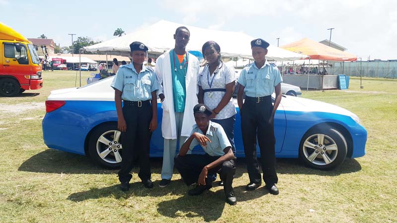  These youths display some of their career choices at the Guyana Police Force’s “A” Division Career Day yesterday. 