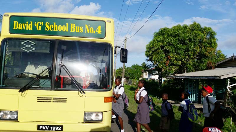 Students boarding the David G School Bus in New Amsterdam, Berbice. 