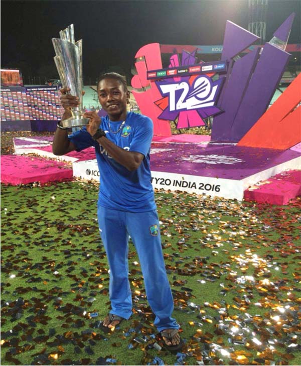 Shemaine Campbelle of the RHTYSC, MS poses with the World Cup. 