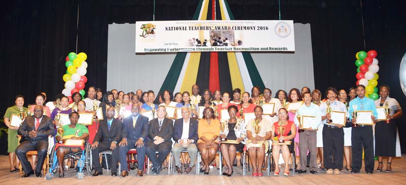 The awardees in the company of Minister of Education, Dr. Rupert Roopnaraine, (seated sixth from left) in the company of other education officials.