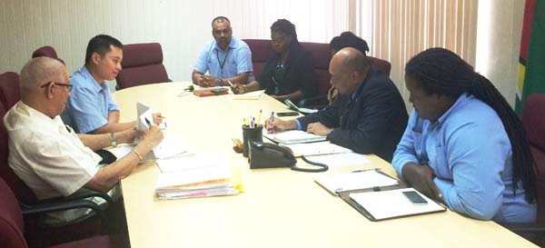 Minister Raphael Trotman (second from right) and his team meeting with the two Bosai representatives.