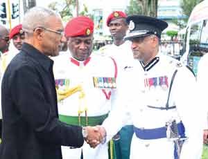 Commissioner of Police Seelall Persaud greets President David Granger at the opening of the 11th Parliament. (File photo)