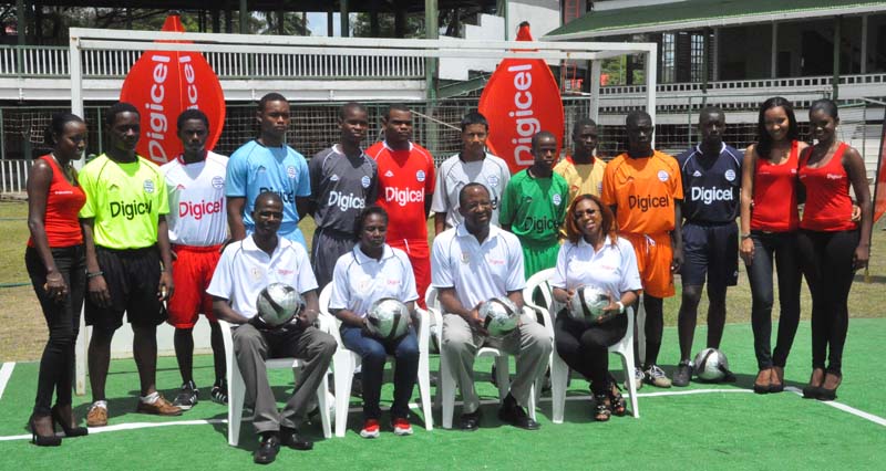 The moment it all started in 2011. (Sitting)-The four principals that made it all possible are Digicel CEO Gregory Dean (2nd right), Head of Marketing Jacqueline James (right), Head of Customer Care Sherwyn Osborne and Head of the Organising Committee Lavern Fraser pose with participating schools representatives.