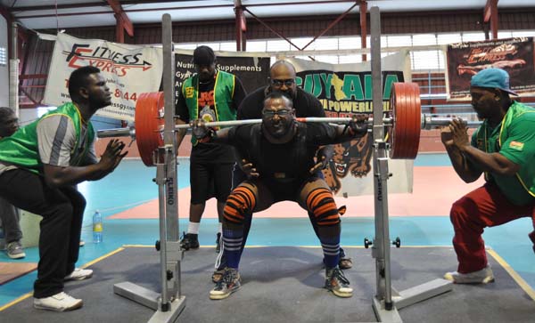 Fazim Abdool being assisted during this squat routine by his brother Farouk Abdool. Franklin Wilson photo.