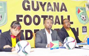 President of the Guyana Football Federation Wayne Forde (centre) addresses the briefing along with Technical Director Jamal Shabazz and PRO Debra Francis last Friday.