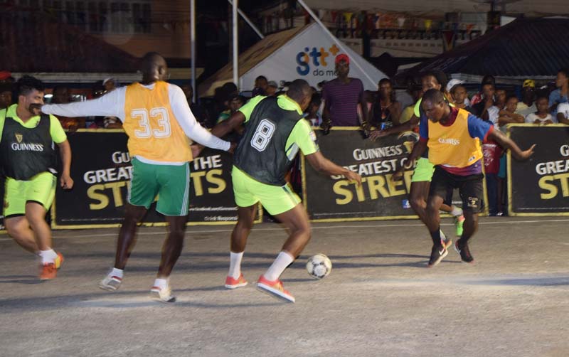 Players fight for ball possession in the clash that featured Magic Stars and Retrieve Unknowns. 