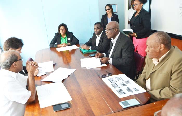 Discussing the proposed architectural designs: Minister of State, Mr. Joseph Harmon (first, right), Advisor on E-Governance, Floyd Levi, Director of Policy and Training, Malcom Williams, Minister of Public Telecommunications, Catherine Hughes and Indian High Commissioner to Guyana, Venkatachalam Mahalingam (first from left) 