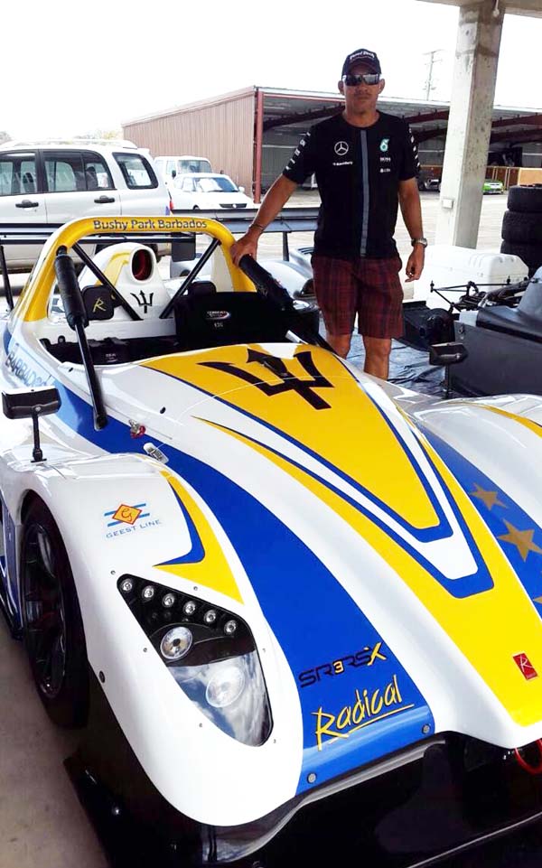 Kevin Jeffrey stands next to the Suzuki Swift Radical SR3 he bought recently for his son Kristian in Barbados recently.