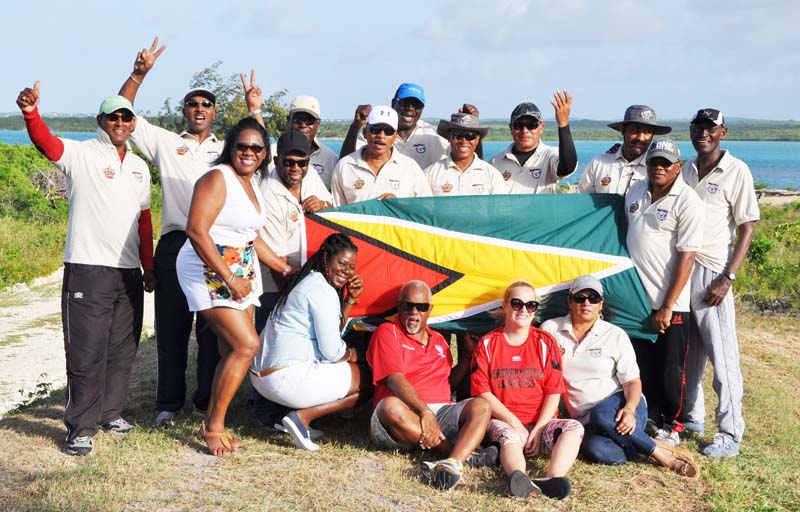 Kings of Fullbore Short Range shooting in the Caribbean, Guyana, pose for a pic with a few Guyanese supporters following their triumph yesterday.