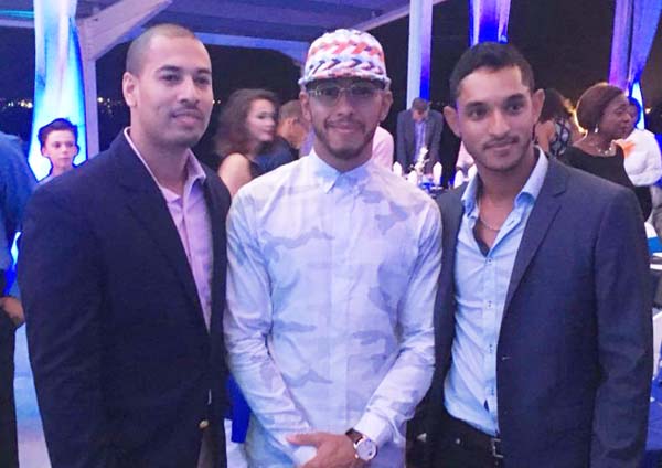 Kristian Jeffrey (right) takes a photo op with Formula 1 champion Lewis Hamilton in Barbados last weekend.