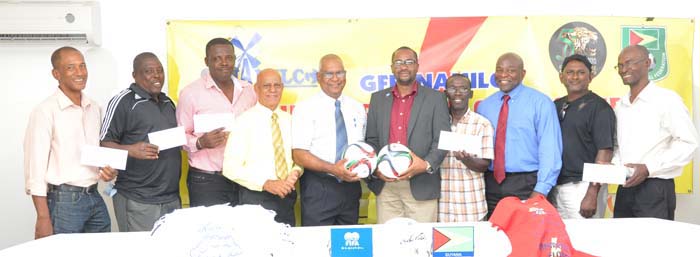 Managing Director of NAMILCO Mr. Bert Sukhai (5th left) and GFF President Wayne Forde (5th right) along with reps of the some of the GFF affiliates after they received their cheques yesterday at the GFF office.
