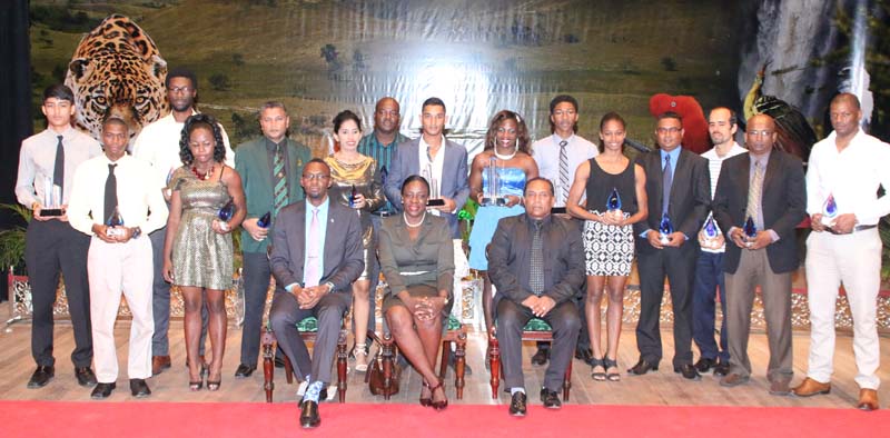 Minister within the Ministry of Education Department of Culture, Youth and Sport, Honorable Nicolette Henry MP (seated center) flanked by Director of Sport Christopher Jones (left) and NSC Chairman Ivan Persaud shares a proud moment with the NSC 2015 Awardees following the presentation of awards on Wednesday night last.