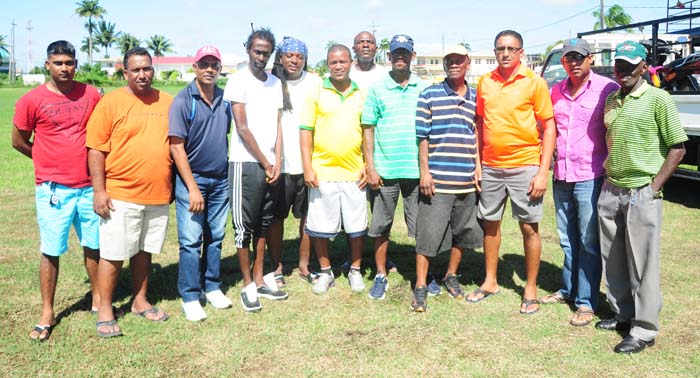  Former National Captain Earl O’ Neil (5th from left) and Dion Barnwell (5th from right) with members of the Georgetown Masters and Regal Sports outfit. 